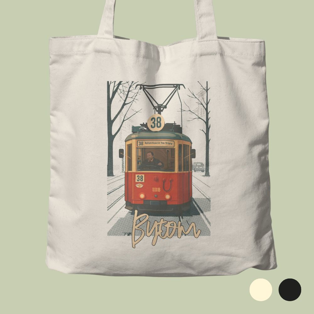 Kremowa bawełniana torba ułożona płasko na szałwiowym tle. Na torbie znajduje się retro grafika przedstawiająca zabytkowy, czerwono-żółty tramwaj linii numer 38 z motorniczym za kierownicą, jadący aleją pośród bezlistnych drzew. Pod ilustracją umieszczono stylizowany, stylograficzny napis „Bytom”. W prawym dolnym rogu zdjęcia widoczne są dwa okręgi oznaczające opcje kolorystyczne: kremową oraz czarną.